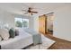 Comfortable bedroom featuring a barn door leading to the en suite bathroom at 3802 Chaffee Ct, Castle Rock, CO 80109