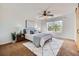 Bright bedroom with ceiling fan, modern decor, and large window overlooking the outdoors at 3802 Chaffee Ct, Castle Rock, CO 80109