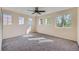 Bright bedroom with neutral walls and carpet, four windows allowing ample natural light at 3802 Chaffee Ct, Castle Rock, CO 80109