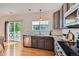 Updated kitchen boasts stainless steel appliances, granite counters and leads out to private deck at 3802 Chaffee Ct, Castle Rock, CO 80109