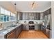 Modern kitchen with granite countertops, stainless steel appliances, and ample cabinet space at 3802 Chaffee Ct, Castle Rock, CO 80109
