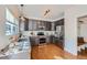 Updated kitchen features stainless steel appliances and granite counters plus hardwood floors at 3802 Chaffee Ct, Castle Rock, CO 80109