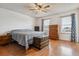 Spacious bedroom featuring hardwood floors, two large windows, and ample natural light at 16533 E Baker Pl, Aurora, CO 80013