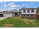 Charming two-story home with a well-maintained front yard and attached two-car garage in a residential neighborhood at 16533 E Baker Pl, Aurora, CO 80013