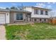 Charming two-story home with a well-maintained front yard and attached two-car garage in a residential neighborhood at 16533 E Baker Pl, Aurora, CO 80013