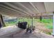Covered patio area with ample space for outdoor activities, including storage, grilling, and recreational use at 16533 E Baker Pl, Aurora, CO 80013
