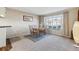 Bright dining room with bay window and wood table at 7379 S Syracuse Ct, Centennial, CO 80112