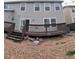 A spacious backyard area with a multi-level wooden deck and ample space for outdoor enjoyment at 9322 Jackson St, Thornton, CO 80229