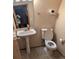 Compact half-bathroom features a pedestal sink and toilet at 9322 Jackson St, Thornton, CO 80229