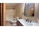 Full bathroom with a tub-shower, new vanity with sleek fixtures, and a modern mirror that complements the neutral walls at 9322 Jackson St, Thornton, CO 80229