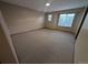 Carpeted bedroom features many windows for lots of natural light at 9322 Jackson St, Thornton, CO 80229