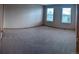 Spacious carpeted bedroom featuring large windows for natural light at 9322 Jackson St, Thornton, CO 80229