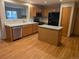 Well-lit kitchen featuring wood cabinets, stainless steel appliances, and a functional center island at 9322 Jackson St, Thornton, CO 80229