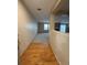 View of the living room with hardwood floors as seen from the front entryway at 9322 Jackson St, Thornton, CO 80229
