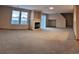 A bright, open living room featuring neutral tones, a cozy fireplace, and ample natural light at 9322 Jackson St, Thornton, CO 80229