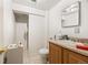 Bathroom with essential fixtures, including sink, toilet, and shower at 2742 S Xanadu Way, Aurora, CO 80014