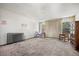 Spacious bedroom with natural light from large windows and potential for updates at 2742 S Xanadu Way, Aurora, CO 80014