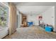 Bright living room with large window, sliding glass door, neutral walls, and ample space at 2742 S Xanadu Way, Aurora, CO 80014