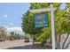 Heather Ridge community sign with lush trees and cars driving by at 2742 S Xanadu Way, Aurora, CO 80014