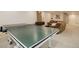 Basement rec room featuring a ping pong table and comfortable seating area at 14075 Turnberry Ct, Broomfield, CO 80023