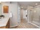 Bathroom featuring a glass-enclosed shower, wood-style flooring, and traditional-style vanity at 14075 Turnberry Ct, Broomfield, CO 80023