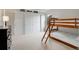 Bedroom with playful decor, featuring a bunk bed and ample closet space for a room at 14075 Turnberry Ct, Broomfield, CO 80023