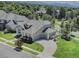 Stunning home featuring lush landscaping, a circular driveway, and an attached three-car garage at 14075 Turnberry Ct, Broomfield, CO 80023