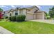 Inviting home with a two car garage, well manicured lawn, and tasteful landscaping at 14075 Turnberry Ct, Broomfield, CO 80023