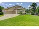 Inviting home with a three car garage, well manicured lawn, and tasteful landscaping at 14075 Turnberry Ct, Broomfield, CO 80023