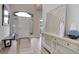 Welcoming foyer with wood floors, bench, and stylish console table at 14075 Turnberry Ct, Broomfield, CO 80023