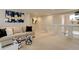 Spacious upstairs living area offers a comfortable sofa, ottomans, and plenty of natural light at 14075 Turnberry Ct, Broomfield, CO 80023