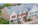 Attractive two-story townhome with colorful facade, decorated gable, and well-kept roof at 6776 S Independence St, Littleton, CO 80128