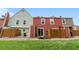 Backyard featuring a green lawn, a wood fence, and an external sliding door at 6776 S Independence St, Littleton, CO 80128