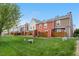 Townhome exteriors showcase fenced yards and lush green space at 6776 S Independence St, Littleton, CO 80128