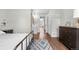 Bedroom with hardwood floors and access to an ensuite bathroom at 6776 S Independence St, Littleton, CO 80128