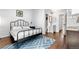 Bedroom with hardwood floors and access to an ensuite bathroom at 6776 S Independence St, Littleton, CO 80128