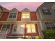 Charming two-story townhome with colorful siding and well-manicured landscaping at 6776 S Independence St, Littleton, CO 80128