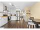 Bright kitchen with white cabinets, stainless steel appliances, and open layout at 6776 S Independence St, Littleton, CO 80128