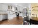 Stylish kitchen features white cabinetry, stainless steel appliances, and wood countertops at 6776 S Independence St, Littleton, CO 80128