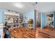 Spacious home office featuring built-in bookshelves, and wood floors at 6776 S Independence St, Littleton, CO 80128