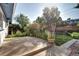 Backyard patio with flower planters, vegetation, and a sunny view at 7704 Newland St, Arvada, CO 80003