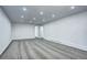 Finished basement area featuring recessed lighting, neutral carpet and paint at 7704 Newland St, Arvada, CO 80003