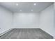Finished basement area featuring recessed lighting, neutral carpet and paint at 7704 Newland St, Arvada, CO 80003