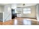 Modern kitchen with white cabinets, granite countertops, and stainless steel appliances at 7704 Newland St, Arvada, CO 80003