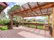 Inviting back deck with pergola offers a relaxing outdoor space and backyard views at 5421 S Vivian St, Littleton, CO 80127