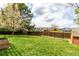 Expansive fenced backyard offers privacy and space for recreation and outdoor enjoyment, backing to neighborhood at 5421 S Vivian St, Littleton, CO 80127