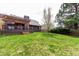A spacious backyard featuring a wooden deck with a pergola, offering an ideal setting for outdoor entertaining at 5421 S Vivian St, Littleton, CO 80127
