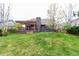 Well-maintained lawn with an attractive deck, pergola, and lush landscaping create an inviting outdoor living space at 5421 S Vivian St, Littleton, CO 80127