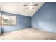 Spacious bedroom featuring a ceiling fan, neutral carpet and a large window offering natural light at 5421 S Vivian St, Littleton, CO 80127