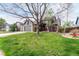 Inviting home with well-maintained lawn, two-car garage and mature trees at 5421 S Vivian St, Littleton, CO 80127